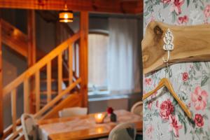 a dining room with a table and a staircase at Rezi Pava in Pava