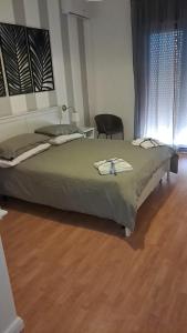 En eller flere senge i et værelse på Esther's Home Casa