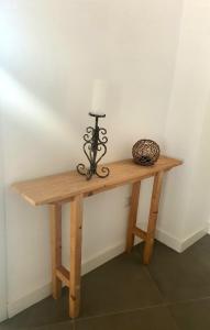 a table with a candle on top of it at Dimora Storica Apartments in Ruviano +7 photos