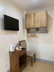 TV a/nebo společenská místnost v ubytování BELLADAMA HOTEL