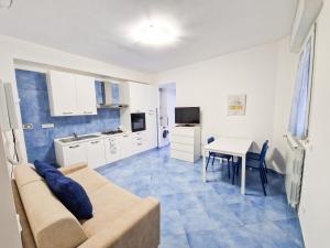 a living room with a couch and a table at Azure Stay in Sperlonga