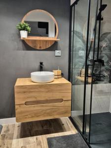 a bathroom with a sink and a mirror at Chill in Lubrza in Lubrza +50 photos