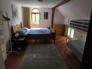 Postel nebo postele na pokoji v ubytování Chalupa Poustevník