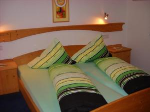 En eller flere senge i et værelse på Residence Alpin