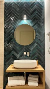 a bathroom with a sink and a mirror at La Pennichella Vista Veneto in Agropoli