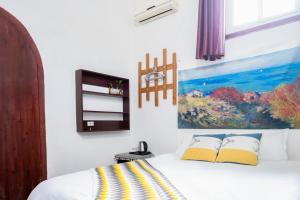 Rúm í herbergi á Jinan Mountain and Sea Culture Hotel