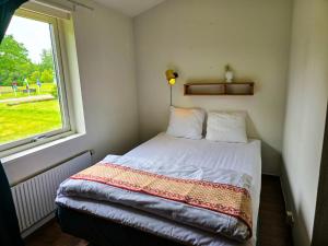 Postel nebo postele na pokoji v ubytování Nature Shelter Hotel