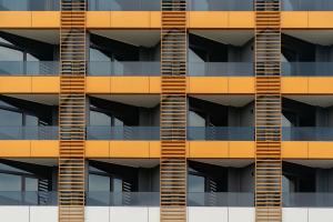 a facade of an apartment building with balconies at Cozy Loft Hotel in Batumi