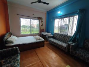 Posezení v ubytování Jayalaxmi guest House
