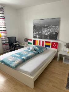 a bedroom with a bed with a painting on the wall at Student Homestay in Im Teller