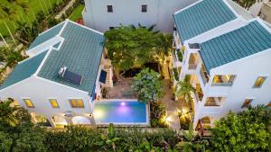 an aerial view of a house with a swimming pool at Secret House Boutique Hoi An in Hoi An
