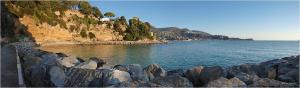 a large group of rocks next to a body of water at Locanda del Sole Nero in San Terenzo