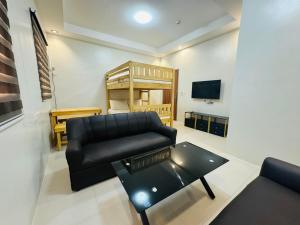 a living room with a couch and a coffee table at Villa Del Cascel in Bulala