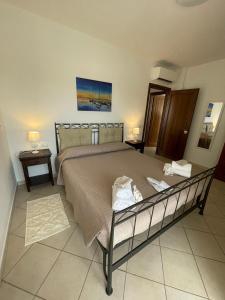 Postel nebo postele na pokoji v ubytování Wanna's Apartment Olbia