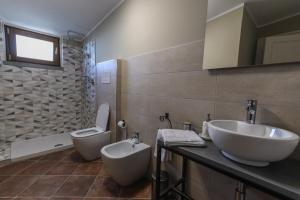 a bathroom with a sink and a toilet at RUGGIERO GUEST HOUSE in Cicerale