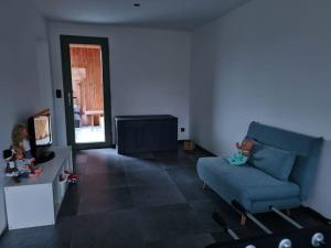 Posezení v ubytování Le Courtil Gîte rural