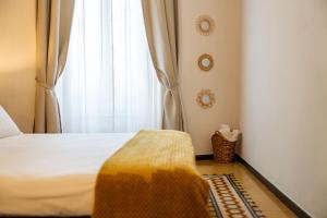 Postel nebo postele na pokoji v ubytování I Remi Del Prione by Le 5 Terre La Spezia