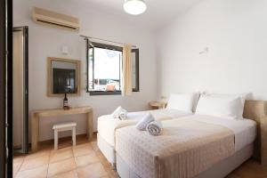 Ένα ή περισσότερα κρεβάτια σε δωμάτιο στο Phevos Villa +37 φωτογραφίες