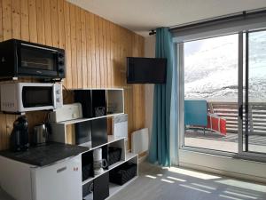 Kuchyň nebo kuchyňský kout v ubytování Ski Piau Engaly, plein sud avec vue sur les pistes à 50 m, cœur de station