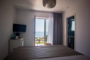 Postel nebo postele na pokoji v ubytování Halta Pescăruş Accommodation