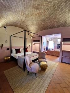 Ένα ή περισσότερα κρεβάτια σε δωμάτιο στο Borgo Dolciano +249 φωτογραφίες