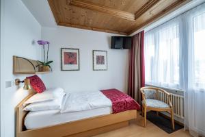 Ένα ή περισσότερα κρεβάτια σε δωμάτιο στο Hotel Vorab - Kulinarische Vielfalt