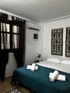 Katil atau katil-katil dalam bilik di Stella's Olive Tree House