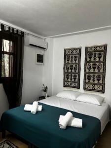 Katil atau katil-katil dalam bilik di Stella's Olive Tree House