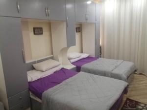 Postel nebo postele na pokoji v ubytování Cecelia Resort Hurghada