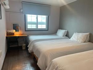 Grim Garden Guesthouse客房内的一张或多张床位
