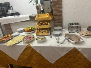 a table with a buffet of food on it at Hotel Fernanda in Letojanni