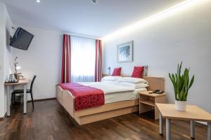 Ένα ή περισσότερα κρεβάτια σε δωμάτιο στο Hotel Vorab - Kulinarische Vielfalt
