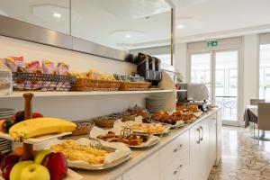 a buffet line with many different types of food at Hotel Bristol in Caorle