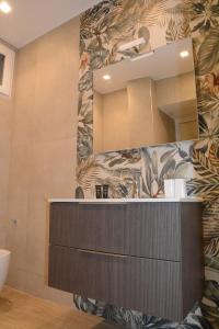 a bathroom with a sink and a mirror at Casa fortino in Catania +35 photos