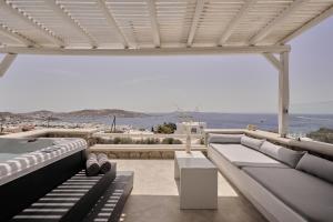 a living room with a view of the ocean at Ovea Mykonos in Mikonos