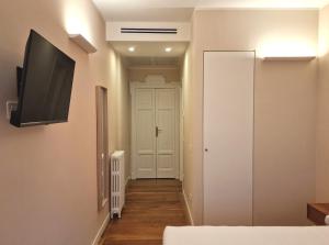 TV a/nebo společenská místnost v ubytování B&B Residenza Cavour