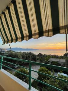 a view of a sunset from a balcony at Pararse Apartments in Vlorë