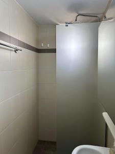 a bathroom with a shower stall and a sink at Sofia Apartments in Paralía Iríon +10 photos