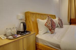 Postel nebo postele na pokoji v ubytování Hotel pleasure inn near turtle beach morjim Manage by ld group of hospitality + 21 fotografií