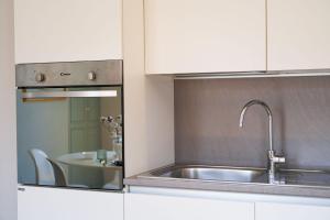 Kuchyňa alebo kuchynka v ubytovaní Duomo Center Apartment + 7 fotografií