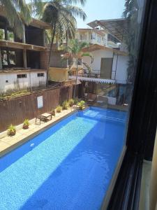 Hotel pleasure inn near turtle beach morjim Manage by ld group of hospitality内部或周边的泳池