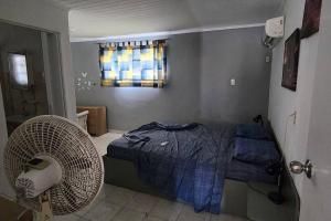 Ένα ή περισσότερα κρεβάτια σε δωμάτιο στο Veeris Apartments