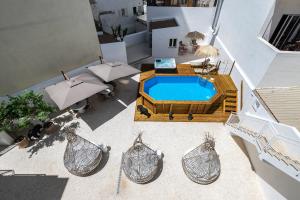 an overhead view of a swimming pool in a house at Dona Simone Boutique Suites & Studios - by @ rita's place in Faro