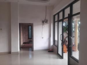 an empty room with a door leading to a bedroom at Villa Lombok Cahaya in Mantang