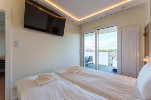 Posteľ alebo postele v izbe v ubytovaní Oaza Spa z prywatną Sauną by Perłowa Przystań Rent