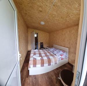 Ένα ή περισσότερα κρεβάτια σε δωμάτιο στο Forest Cabins