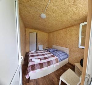 Postel nebo postele na pokoji v ubytování Forest Cabins