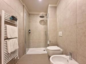 a bathroom with a shower and a toilet and a sink at B&B Residenza Cavour in Como