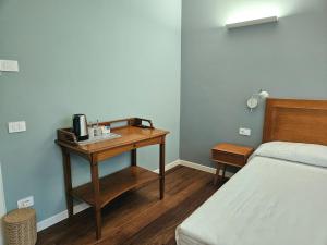 Postel nebo postele na pokoji v ubytování B&B Residenza Cavour
