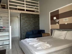 Postel nebo postele na pokoji v ubytování Ellas Hotel